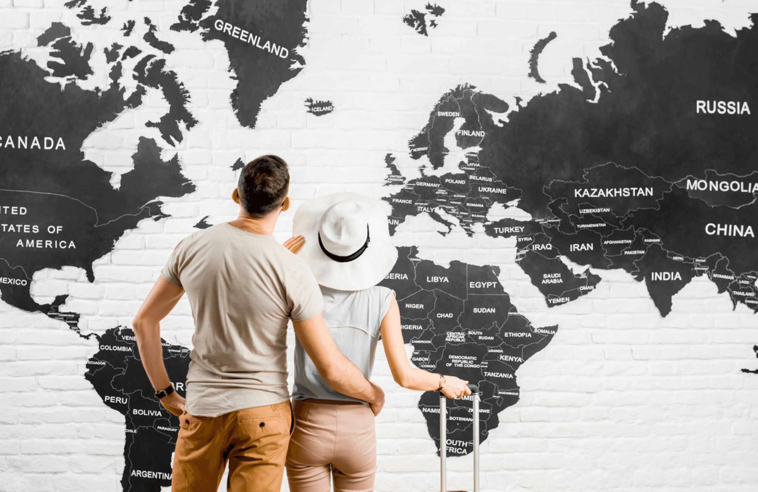 Couple looking at world map